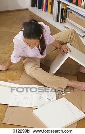 assembling, caucasian, casual, artificial light View Large Photo Image Stock Image - assembling, caucasian, casual, artificial light. Fotosearch