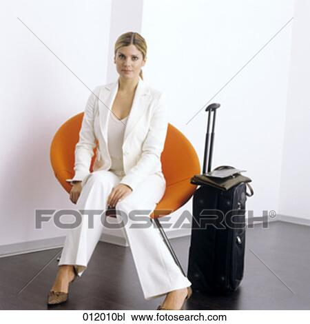 Stock Image - bag, blond hair, artificial light. Fotosearch