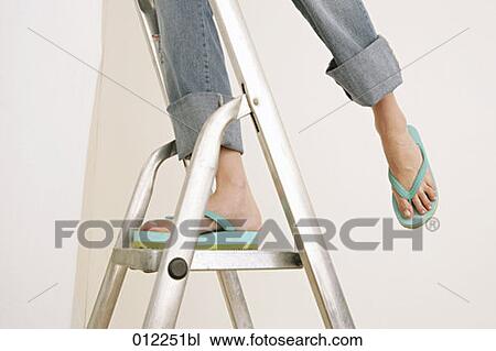 Stock Image - balance, body detail, artificial light. Fotosearch
