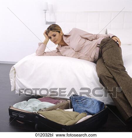 Stock Image - bed, bedroom, artificial light. Fotosearch