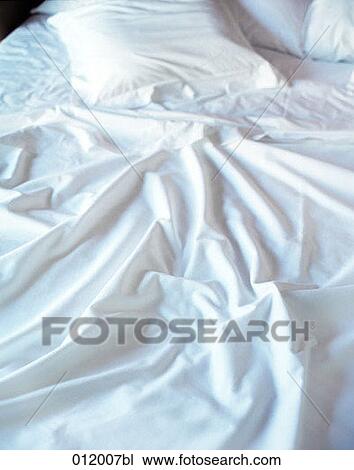 Stock Image - blanket, bed, beds, bedrooms, bedroom, blankets, artificial light. Fotosearch