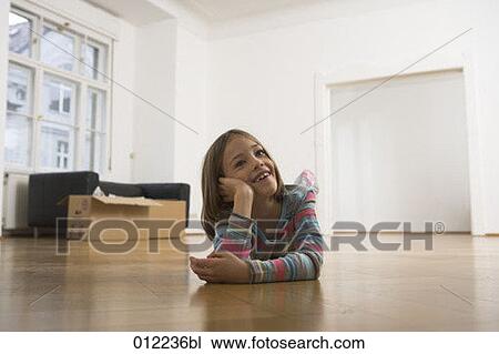 Stock Image - blond hair, Yashoda, artificial light, apartment, anticipation, 7-9 years. Fotosearch