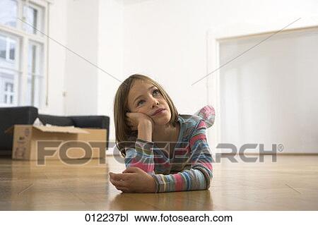 Stock Image - blonde, Yashoda, blond hair, artificial light, apartment, 7-9 years. Fotosearch