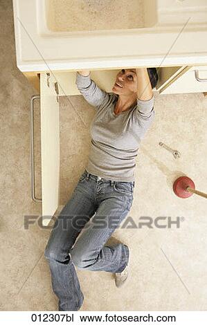 Stock Image - blue jeans, caucasian, casual, artificial light. Fotosearch