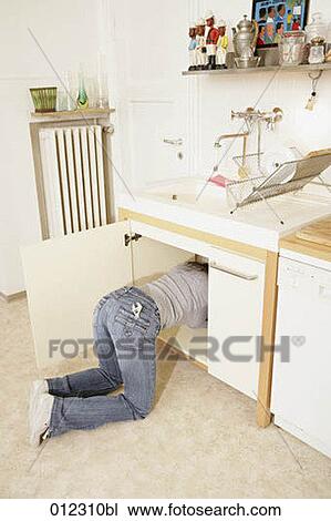 Stock Image - blue jeans, caucasian, casual, artificial light. Fotosearch