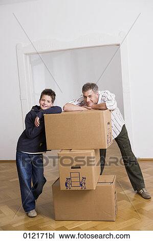 Stock Image - carton box, Yashoda, boy, artificial light, apartment, 10-12 years. Fotosearch