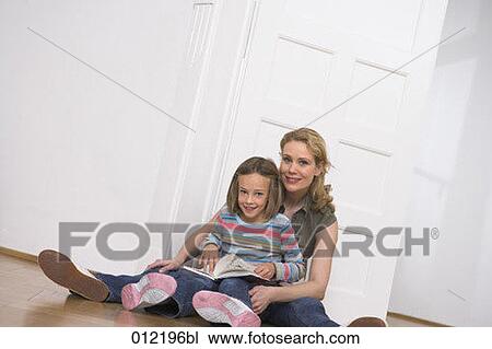 Stock Image - Yashoda, blond hair, artificial light, apartment, 7-9 years. Fotosearch