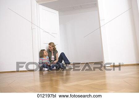 Stock Image - Yashoda, blond hair, artificial light, apartment, 7-9 years. Fotosearch