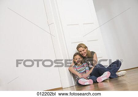Stock Image - Yashoda, blond hair, artificial light, apartment, 7-9 years. Fotosearch
