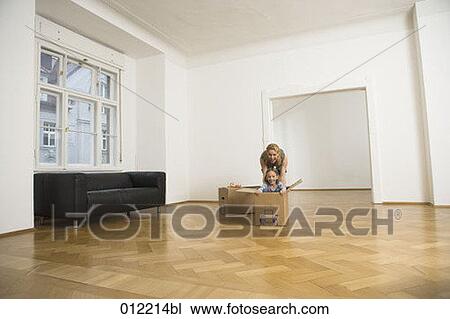 Stock Image - Yashoda, blond hair, artificial light, apartment, 7-9 years. Fotosearch