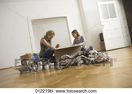 Stock Image - Yashoda, blond hair, artificial light, apartment, 7-9 years. Fotosearch
