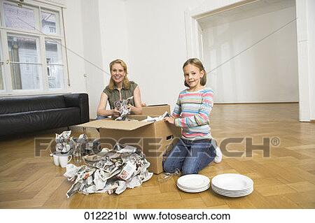 Stock Image - Yashoda, blond hair, artificial light, apartment, 7-9 years. Fotosearch