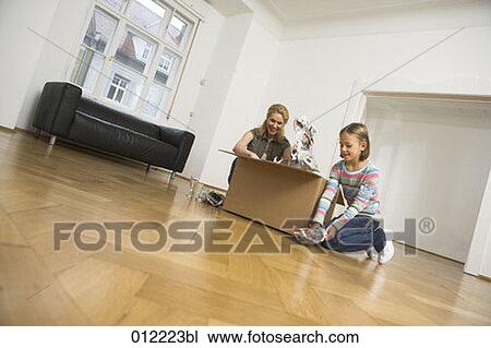 Stock Image - Yashoda, blond hair, artificial light, apartment, 7-9 years. Fotosearch