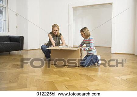 Stock Image - Yashoda, blond hair, artificial light, apartment, 7-9 years. Fotosearch