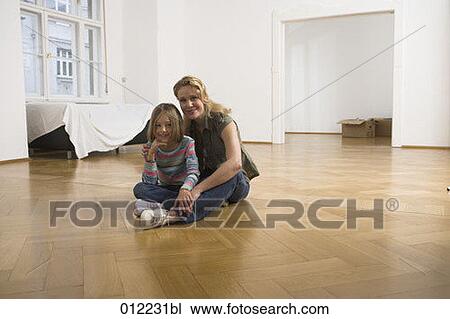 Stock Image - Yashoda, blond hair, artificial light, apartment, 7-9 years. Fotosearch