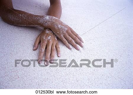 close-up of female hands covered with white sand View Large Photo Image Stock Image - close-up of female hands covered with white sand. Fotosearch