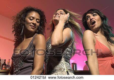 close-up of three young women dancing View Large Photo Image Stock Image - close-up of three young women dancing. Fotosearch