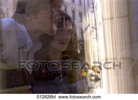 close-up of young couple looking at shop window View Large Photo Image Stock Image - close-up of young couple looking at shop window. Fotosearch