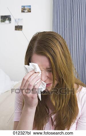 crying woman rubbing her eyes with tissue View Large Photo Image Stock Image - crying woman rubbing her eyes with tissue. Fotosearch