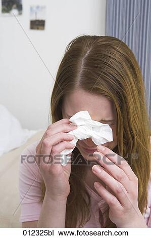 crying young woman holding tissue View Large Photo Image Stock Image - crying young woman holding tissue. Fotosearch