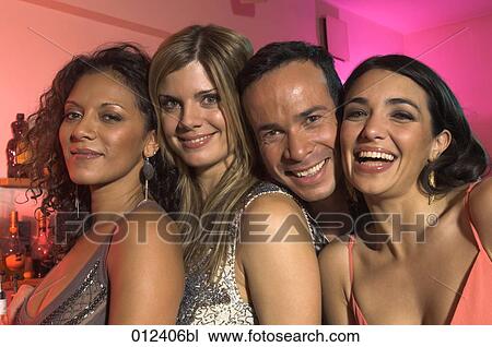 Stock Image - four friends smiling cheek to cheek. Fotosearch