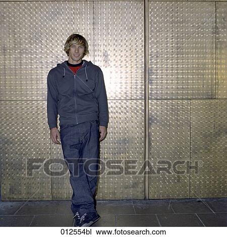 full body portrait of young man leaning on wall View Large Photo Image Stock Image - full body portrait of young man leaning on wall. Fotosearch