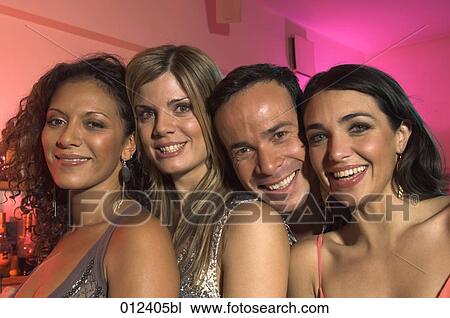 Stock Image - group of four friends showing a radiant smile. Fotosearch