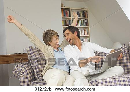 happy couple having won an internet auction View Large Photo Image Stock Image - happy couple having won an internet auction. Fotosearch