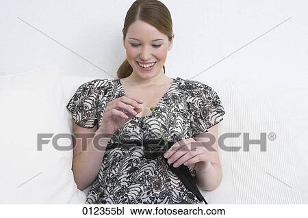 happy young woman plucking flower petals View Large Photo Image Stock Image - happy young woman plucking flower petals. Fotosearch