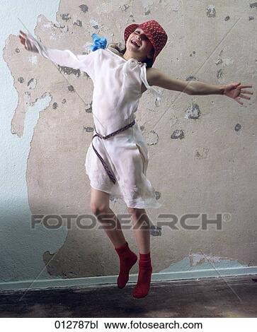 joyous girl jumping for joy in empty room View Large Photo Image Stock Image - joyous girl jumping for joy in empty room. Fotosearch
