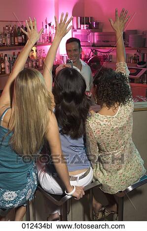 joyous group of women photographed by bartender View Large Photo Image Stock Image - joyous group of women photographed by bartender. Fotosearch