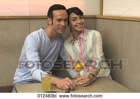 man and woman posing for a portrait in cafe View Large Photo Image Stock Image - man and woman posing for a portrait in cafe. Fotosearch