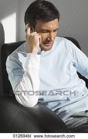 mature at home talking on cellular phone View Large Photo Image Stock Image - mature at home talking on cellular phone. Fotosearch