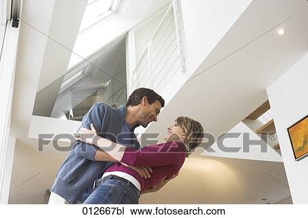 Stock Image - mature couple having fun together. Fotosearch