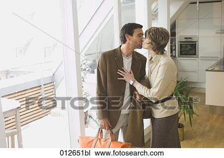 mature couple kissing for goodbye View Large Photo Image Stock Image - mature couple kissing for goodbye. Fotosearch