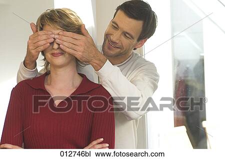 mature couple playing peekaboo View Large Photo Image Stock Image - mature couple playing peekaboo. Fotosearch