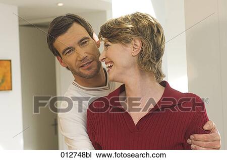 Stock Image - mature couple sharing a laugh. Fotosearch