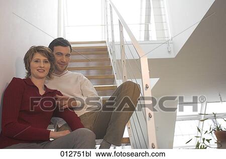 mature couple sitting on stairs of their home View Large Photo Image Stock Image - mature couple sitting on stairs of their home. Fotosearch