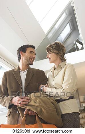 mature couple smiling at each other in maisonette View Large Photo Image Stock Image - mature couple smiling at each other in maisonette. Fotosearch