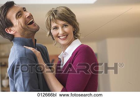 mature couple woman smiling and man laughing heartily View Large Photo Image Stock Image - mature couple woman smiling and man laughing heartily. Fotosearch