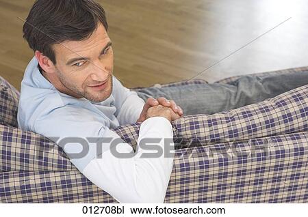 mature man sitting comfortably on sofa View Large Photo Image Stock Image - mature man sitting comfortably on sofa. Fotosearch