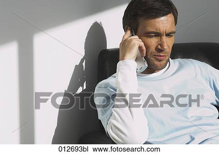 mature man with thoughtful expression listening to mobile View Large Photo Image Stock Image - mature man with thoughtful expression listening to mobile. Fotosearch