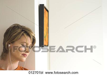 mature woman listening to music with eyes closed View Large Photo Image Stock Image - mature woman listening to music with eyes closed. Fotosearch