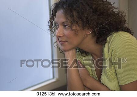 portrait of african woman looking out of window View Large Photo Image Stock Image - portrait of african woman looking out of window. Fotosearch