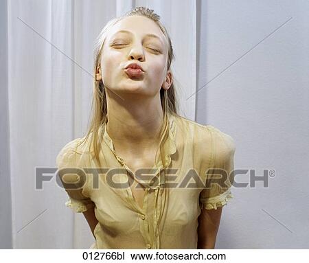 Stock Image - portrait of blonde teenager pouting. Fotosearch