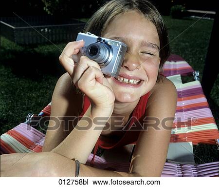 portrait of girl having fun with digital camera View Large Photo Image Stock Image - portrait of girl having fun with digital camera. Fotosearch