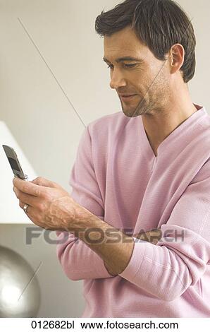 portrait of mature man writing text message on cellphone View Large Photo Image Stock Image - portrait of mature man writing text message on cellphone. Fotosearch
