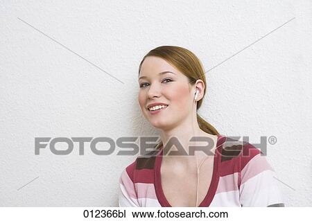 portrait of red haired teenage girl with headphones View Large Photo Image Stock Image - portrait of red haired teenage girl with headphones. Fotosearch