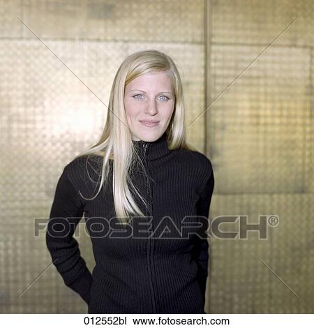 portrait of self confident looking blonde girl in black jumper View Large Photo Image Stock Image - portrait of self confident looking blonde girl in black jumper. Fotosearch