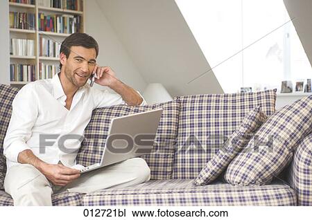 portrait of smiling mature adult with cellphone and laptop computer View Large Photo Image Stock Image - portrait of smiling mature adult with cellphone and laptop computer. Fotosearch